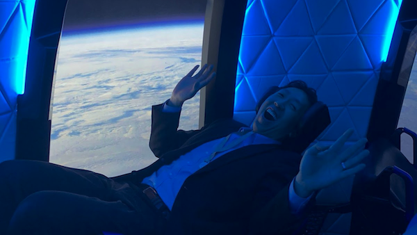 Andrew Ng sitting in the Blue Origin passenger capsule