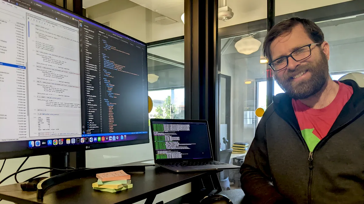 Jared Webb in front of a computer monitor