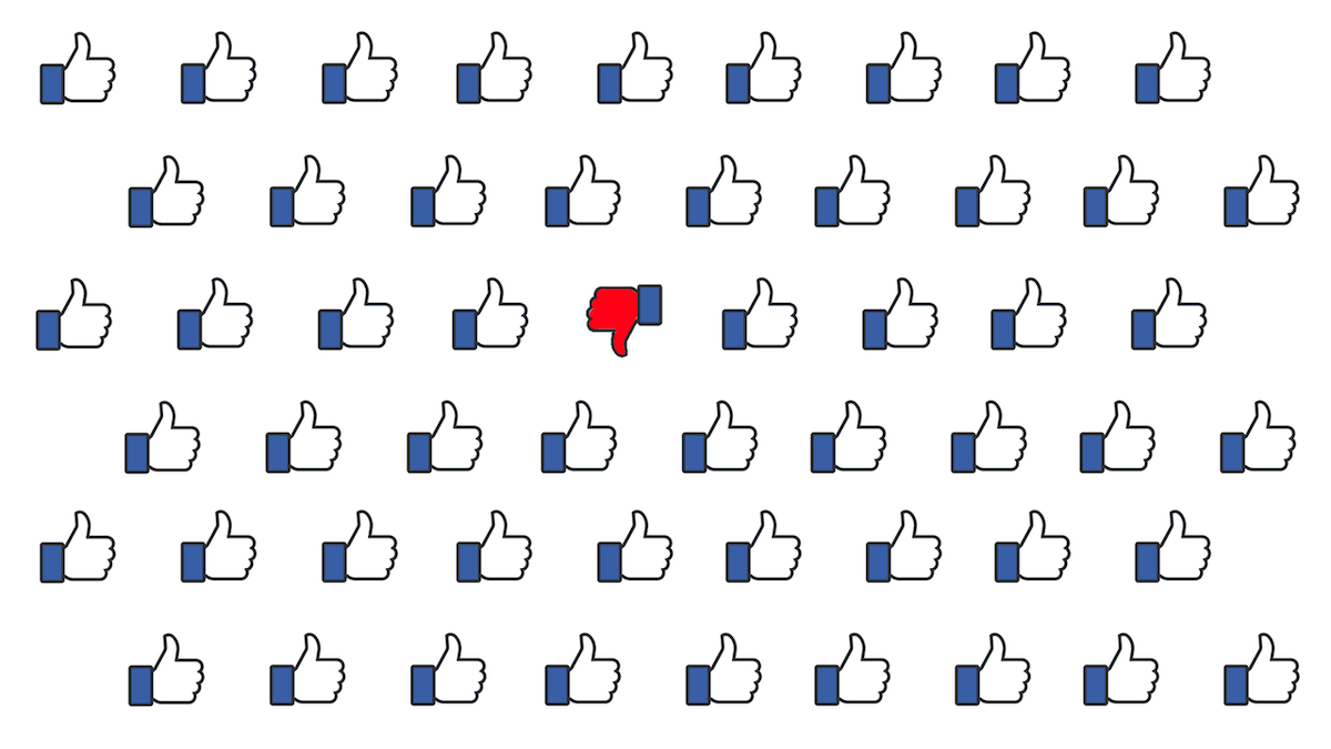 A red Facebook dislike button surrounded by dozens of Facebook like buttons