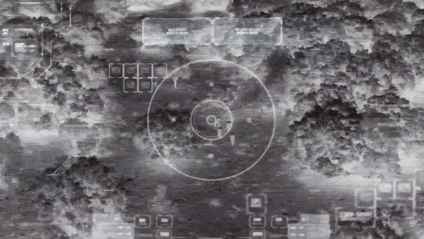 Drone with thermal night vision camera view of soldiers walking on a field