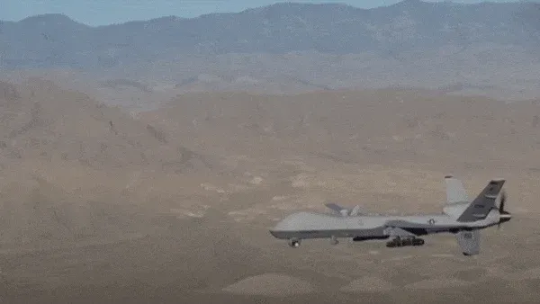 Animated GIF of a pilotless drone flying near mountains
