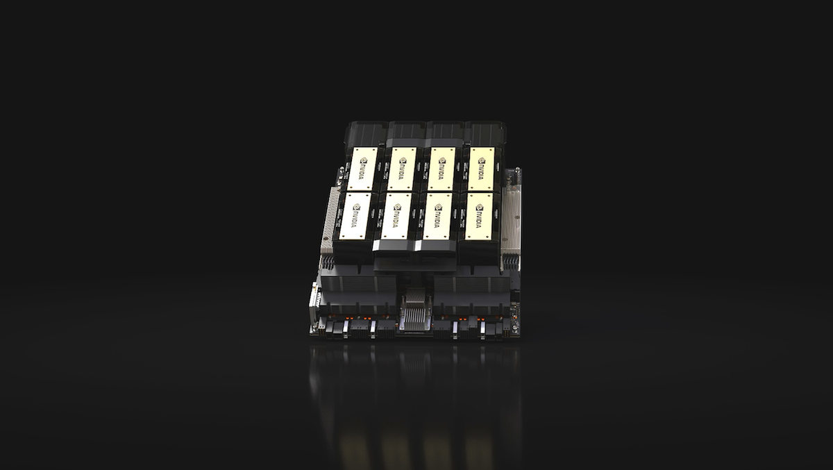 NVIDIA AI computing hardware with multiple GPUs on a black reflective surface.